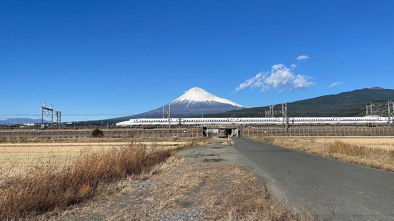Shinkansen bullet train passing Mount Fuji, Japan