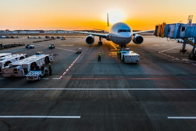Gray airplane parked at the gate before departure