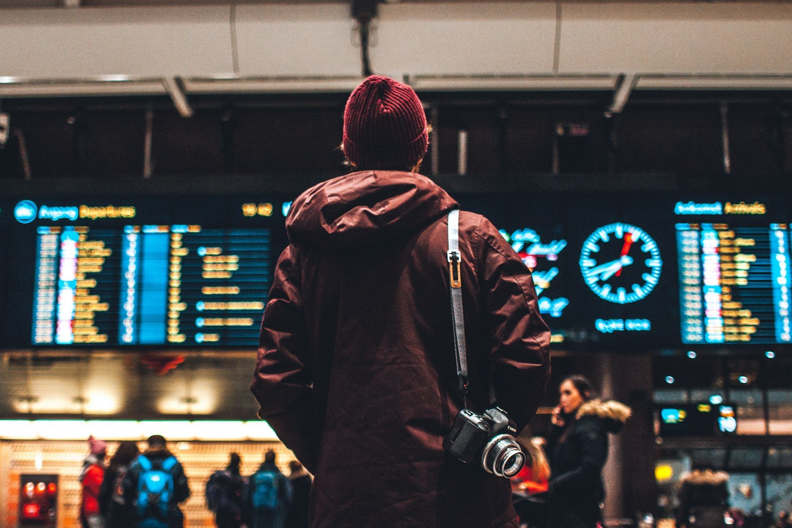 Traveler looking up at the flight schedules board