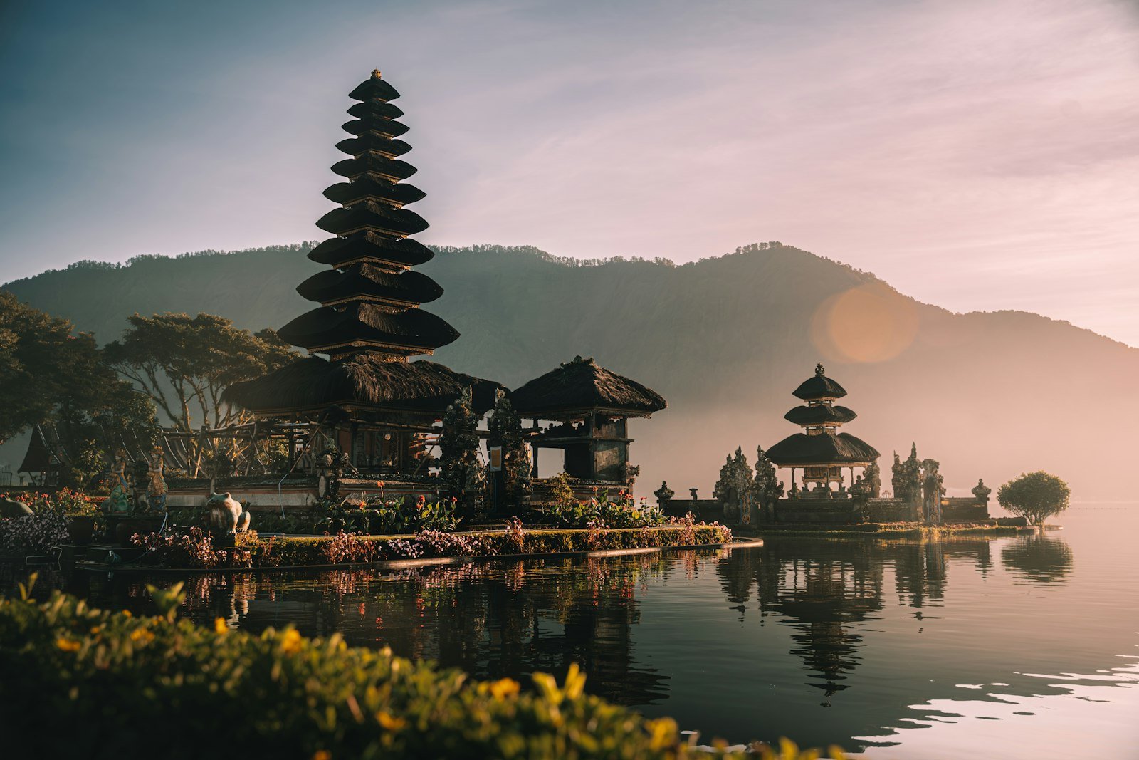 Pura Ulun Danu Bratan temple on a lake in Bali at golden hour